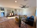 Open concept living and dining areas with hardwood floors at 11808 S Half Moon Dr, Phoenix, AZ 85044