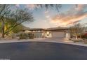 Attractive single-story home with landscaped desert front yard and two-car garage at 14245 N Territory Trl, Fountain Hills, AZ 85268