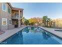 Inviting backyard pool with mature landscaping, mountain views, and spacious deck for outdoor entertaining at 15237 S 19Th Way, Phoenix, AZ 85048