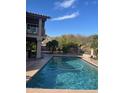 Backyard pool with desert landscape and exterior view of home at 15237 S 19Th Way, Phoenix, AZ 85048