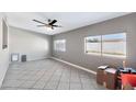 Bright living room featuring tile floors and large windows at 1604 W Kerry Ln, Phoenix, AZ 85027