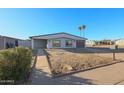 Charming single story home with a low maintenance front yard and driveway at 1637 W Tierra Buena Ln, Phoenix, AZ 85023