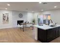 Open concept dining area features a whitewashed brick fireplace at 1936 E Cornell Dr, Tempe, AZ 85283