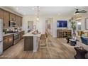 Modern kitchen with island and stainless steel appliances at 22343 W Monona Ln, Surprise, AZ 85387