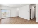 Bright and airy living room with sliding door to backyard at 25359 W Sunland Ave, Buckeye, AZ 85326