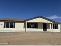 New home with a covered porch and dark brown accents at 25603 W Hedgehog Rd, Wittmann, AZ 85361