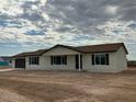 New construction home with a two-car garage and neutral exterior at 25603 W Hedgehog Rd, Wittmann, AZ 85361