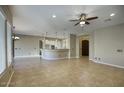 Open kitchen with island and granite countertops at 28548 N 68Th Ave, Peoria, AZ 85383