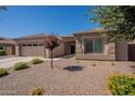 Landscaped one story home with a two-car garage and neutral color scheme at 2925 E Tonto Dr, Gilbert, AZ 85298