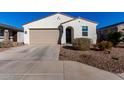 Charming single story home with neutral color and landscaping at 35170 W La Paz St, Maricopa, AZ 85138