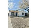 Charming single-story home with a modern pergola and black trim windows at 4032 N 11Th Ave, Phoenix, AZ 85013