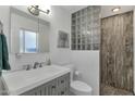 Updated bathroom with gray vanity and walk-in shower at 4048 W Sierra Vista Dr, Phoenix, AZ 85019