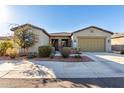 Single-story home with two-car garage and desert landscaping at 42085 W Morning Glory Way, Maricopa, AZ 85138