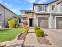 Two-story house with stone accents and a landscaped front yard at 44622 N Sonoran Arroyo Ln, New River, AZ 85087