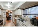 Modern kitchen featuring stainless steel appliances and white cabinets at 4539 W Mclellan Rd, Glendale, AZ 85301