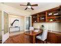 Home office with built-in bookcases and hardwood floors at 4655 E Indigo St, Gilbert, AZ 85298