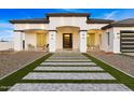 Front view of a beautiful home with a walkway and seating area at 6105 N 174Th Ave, Waddell, AZ 85355