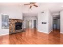 Living room features hardwood floors and a stone fireplace at 7101 W Beardsley Rd # 942, Glendale, AZ 85308