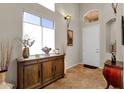 Bright and airy entryway with a wooden console table at 8137 N 13Th Pl, Phoenix, AZ 85020