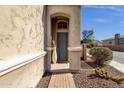 Inviting front entryway with a tall vase and brick walkway at 8137 N 13Th Pl, Phoenix, AZ 85020