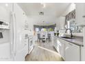 White kitchen with granite countertops and stainless steel appliances at 8383 W Utopia N Rd, Peoria, AZ 85382