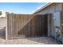 Wooden gate providing backyard access at 8828 E Des Moines St, Mesa, AZ 85207