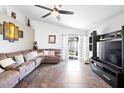 Spacious living room with a large sectional sofa and tile flooring at 8828 E Des Moines St, Mesa, AZ 85207