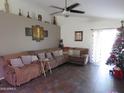 Spacious living room with L-shaped sectional sofa at 8828 E Des Moines St, Mesa, AZ 85207