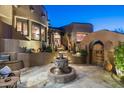 Inviting courtyard with a fountain, seating area, and native plants at 9839 E Madera E Dr, Scottsdale, AZ 85262