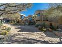 This home has a unique design and is nestled in a beautiful desert landscape at 9839 E Madera E Dr, Scottsdale, AZ 85262