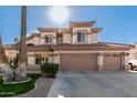 Two-story house with three-car garage and landscaped front yard at 1435 E Oxford Ln, Gilbert, AZ 85295