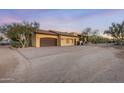 Attached garage with a paver driveway at 14705 E Redbird Rd, Scottsdale, AZ 85262