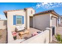 Cozy front patio with seating area, perfect for relaxing at 17734 W Amber Ridge Way, Goodyear, AZ 85338