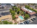 Community pool and surrounding buildings in a complex at 1950 N Center St # 104, Mesa, AZ 85201