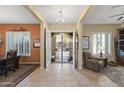 Bright and spacious entryway with tile flooring, leading to living areas at 19957 N Rawhide Way, Surprise, AZ 85387