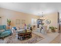 Open living and dining area with comfy seating and a large area rug at 3766 W Jacksonville Dr, Anthem, AZ 85086