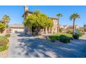 Two-story house with a large tree in the front yard and a long driveway at 3798 E Latham Ct, Gilbert, AZ 85297