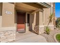 Elegant front door with stone accents and a welcoming entryway at 3798 E Latham Ct, Gilbert, AZ 85297