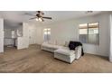 Open concept living room with a view into the kitchen at 41517 N Ranch Dr, San Tan Valley, AZ 85140