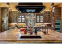 Gourmet kitchen with custom cabinetry and high-end appliances at 66 Biltmore Est, Phoenix, AZ 85016