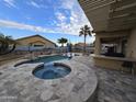 Inviting backyard oasis with a large pool and spa at 665 N Wyatt Dr, Chandler, AZ 85226