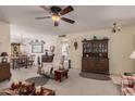 Spacious living room with a dining area and hardwood floors at 9245 N 109Th Dr, Sun City, AZ 85351