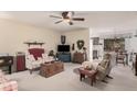 Cozy living room featuring a comfortable couch and a charming country decor at 9245 N 109Th Dr, Sun City, AZ 85351