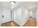 Bright entryway with hardwood floors and white door at 11209 N 40Th St, Phoenix, AZ 85028