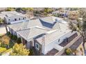 An aerial view reveals the home's architectural details and surrounding landscape at 11243 E Flintlock Dr, Chandler, AZ 85249