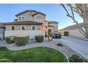 Two-story home with landscaped front yard and a long driveway at 1253 E Debbie Dr, San Tan Valley, AZ 85140