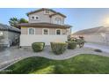 Two-story house with well-manicured lawn and shrubbery at 1253 E Debbie Dr, San Tan Valley, AZ 85140