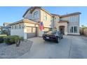 Two-story home with attached two-car garage and landscaped front yard at 1253 E Debbie Dr, San Tan Valley, AZ 85140