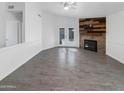 Spacious living room with tile floors and a fireplace at 1433 E Kerry Ln, Phoenix, AZ 85024