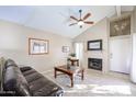 Living room with vaulted ceiling, fireplace and patio access at 16644 N 33Rd St # 105, Phoenix, AZ 85032